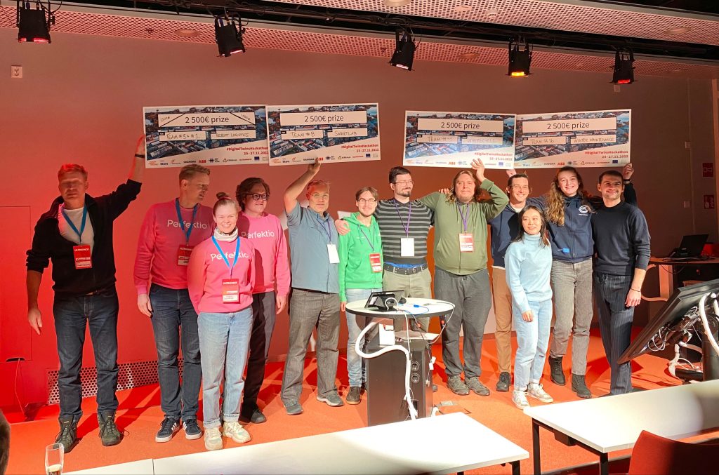 The picture shows four teams awarded at the hackathon event.